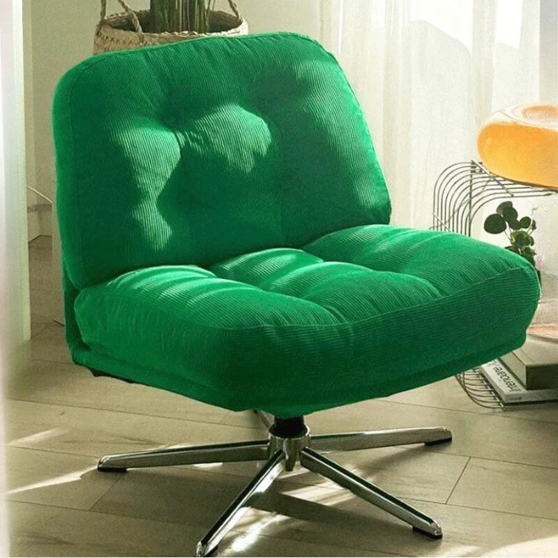 Fauteuil lounge pivotant capitonné